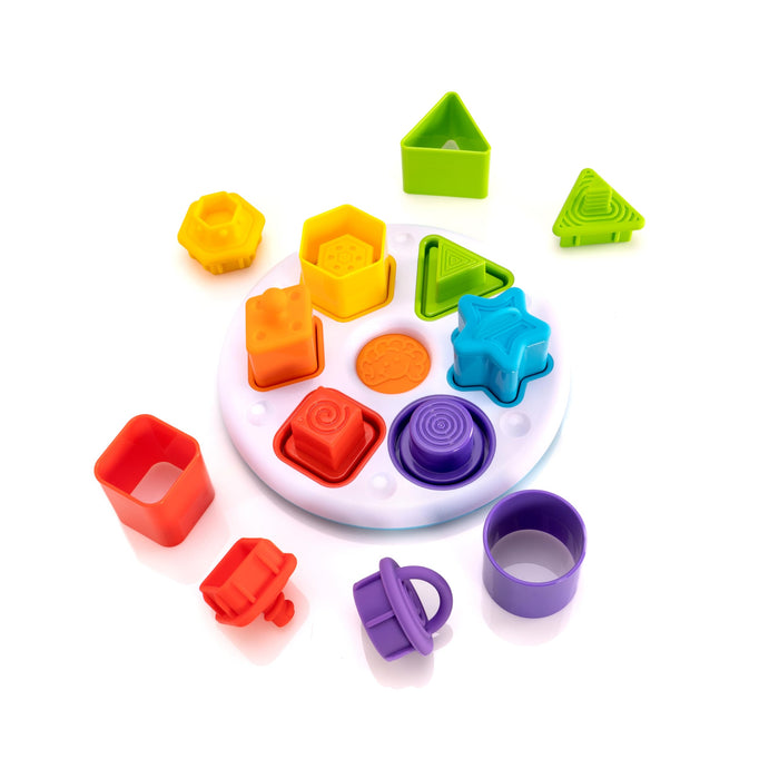 Fat Brain Toys Plugzy Gioco educativo sensoriale Impila e Incastra, 6 diverse forme e colori da abbinare tra loro, con cappuccio in silicone alimentare, diversi modi di giocare, adatto dai 10 mesi