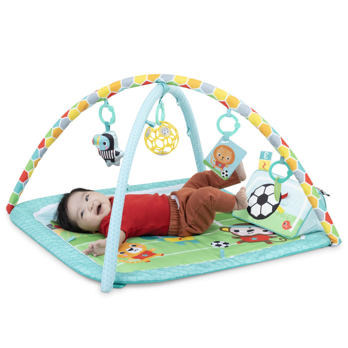Bright Starts, Palestra Attività a Tema Calcio Oball, 4 Modalità di Gioco: Tappetino Lavabile con Cuscino per Pancia, Arco Removibile, Luci e 30+ Melodie, Unisex, 0+ Mesi
